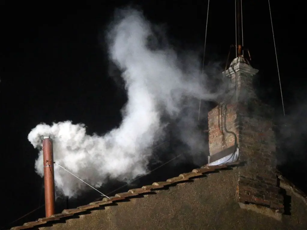 What does white and black smoke mean?
